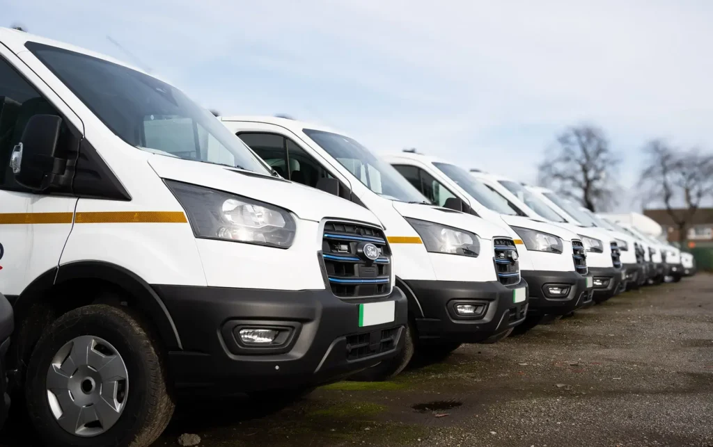 A close up of a fleet of vans.